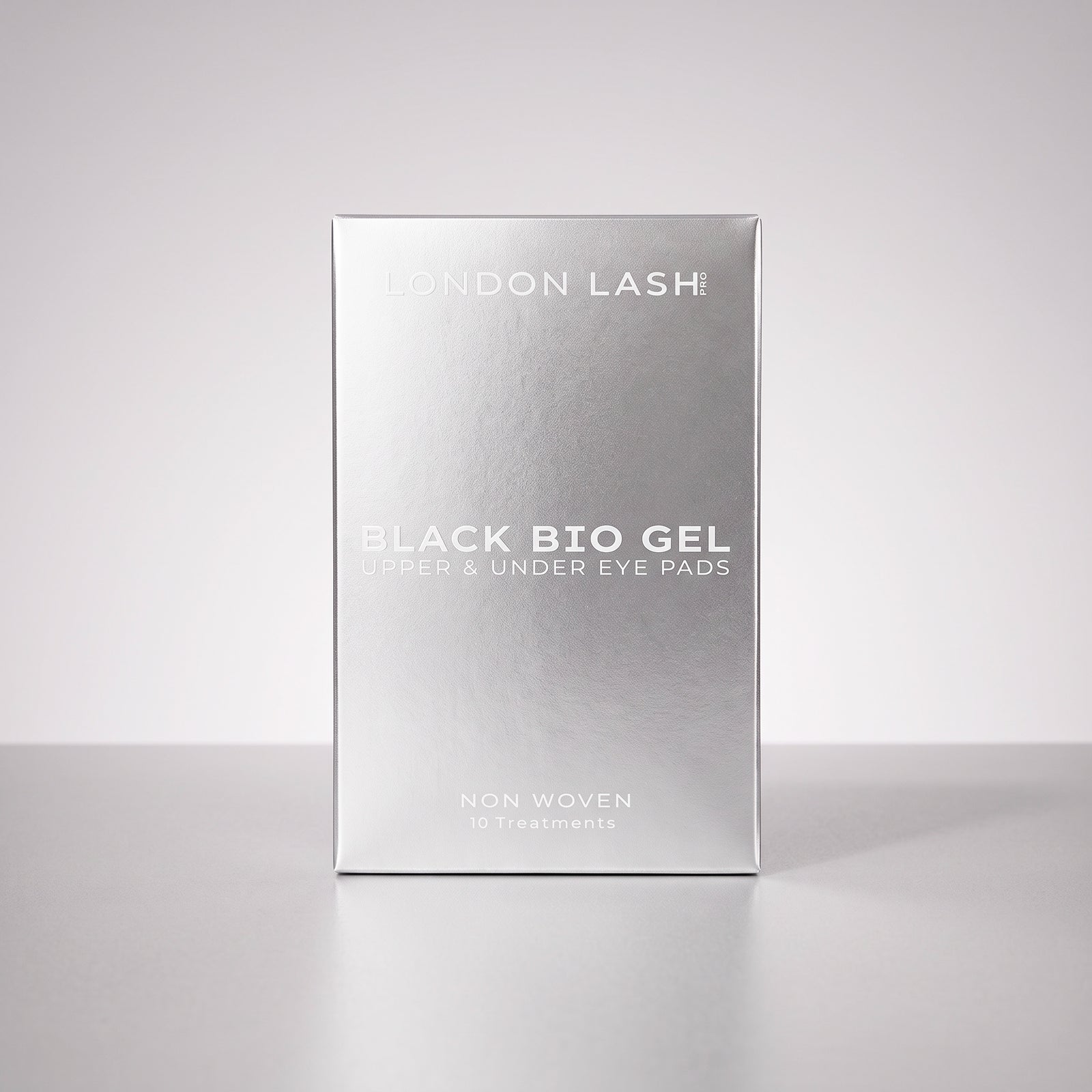 A silver rectangular box of London Lash Black Bio Gel upper and under eye pads, shown standing upright on a light gray background.