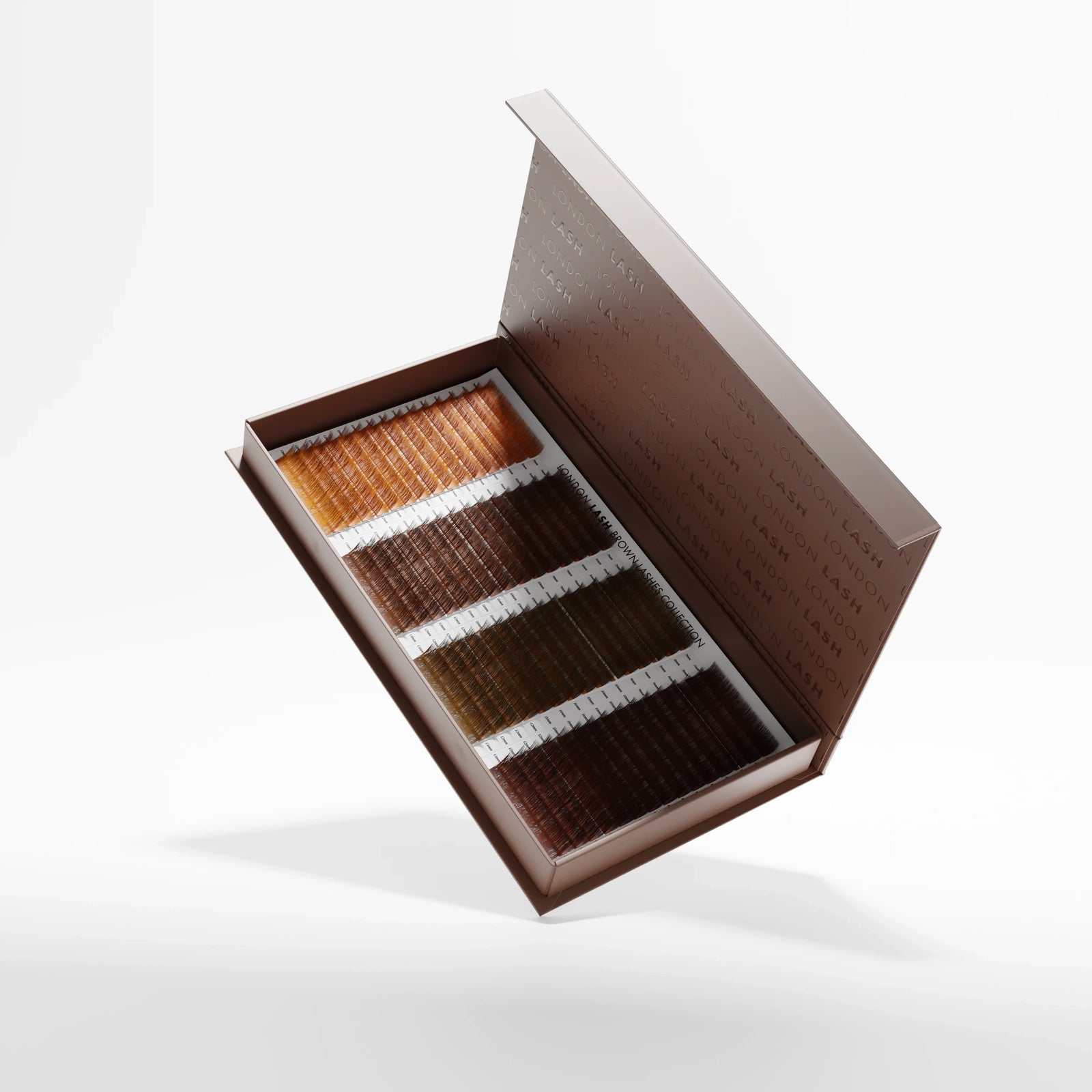Open brown lashes mix tray with four different tones on a white background