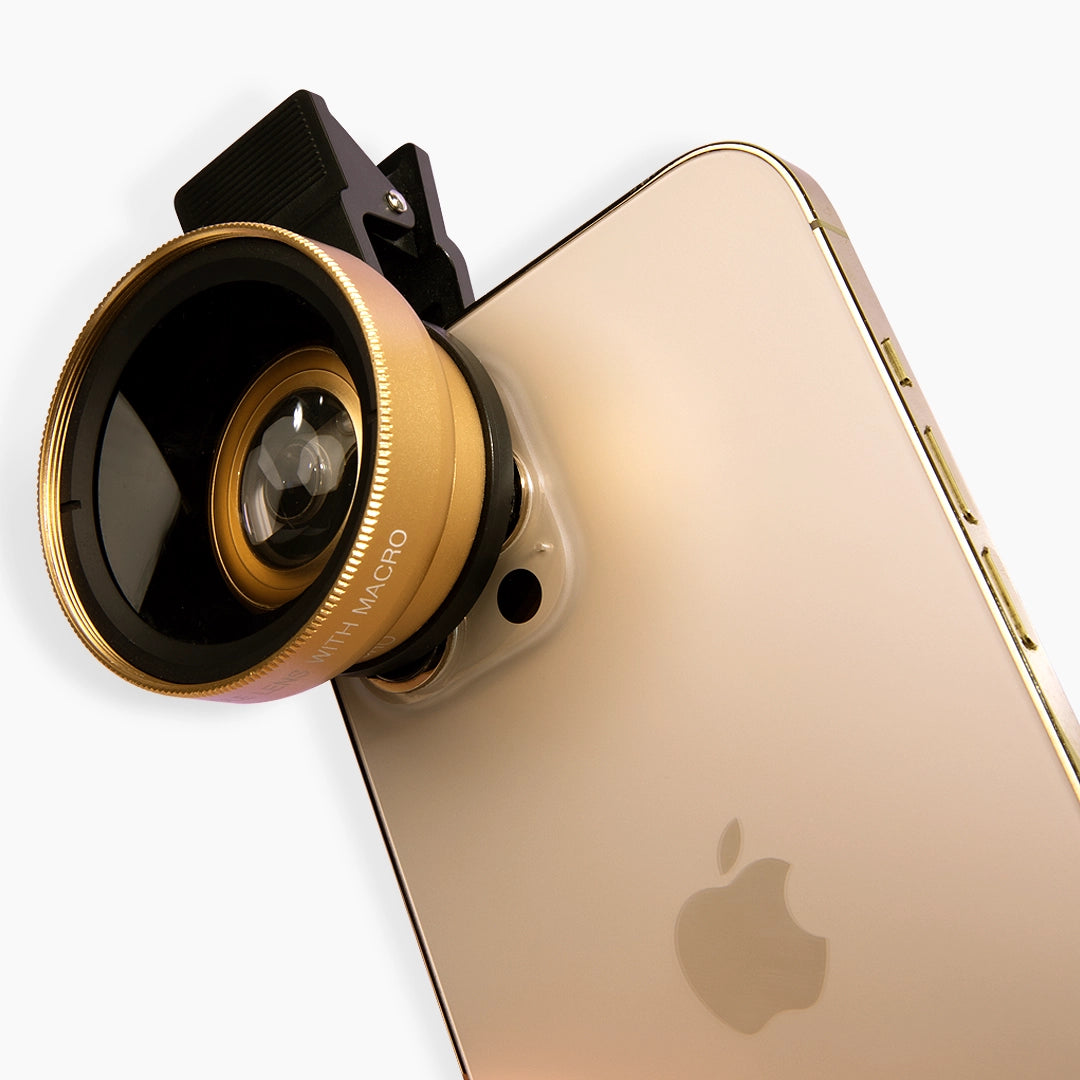 Gold smartphone with a macro lens attachment on a white background 