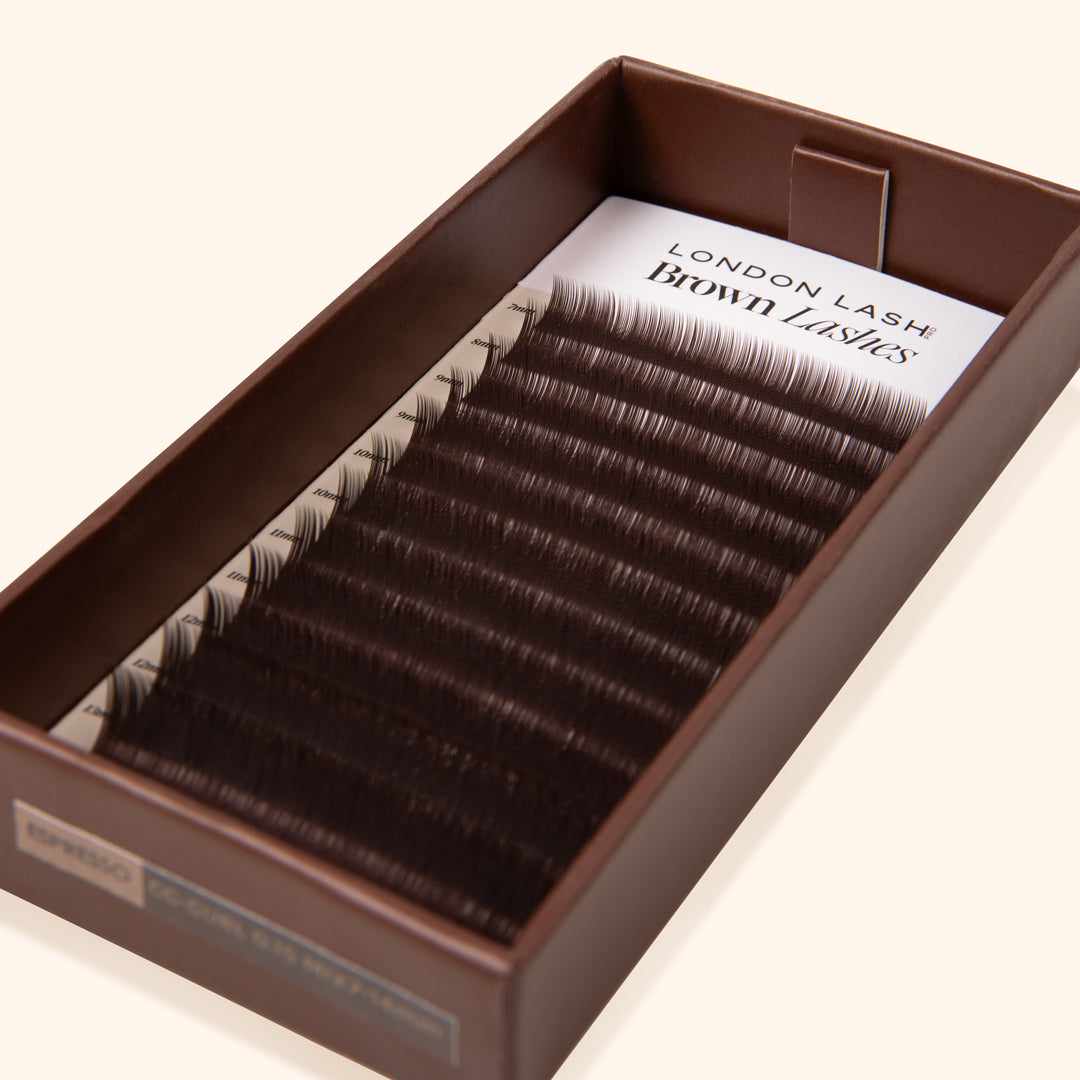 cruelty free synthetic dark brown eyelash extension inside an opened eco lash tray