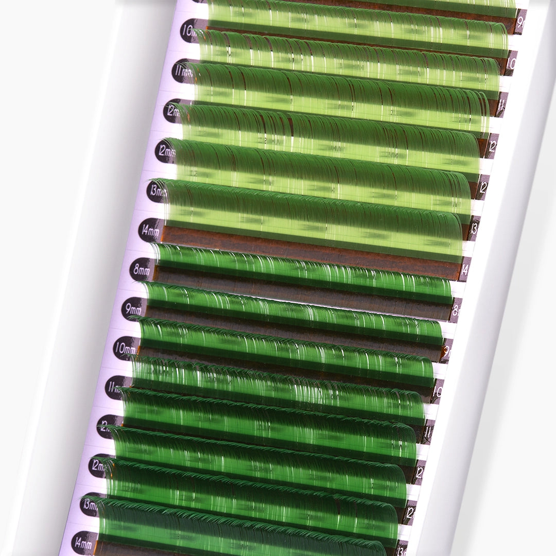 Close up image of light green and green faux mink coloured lash extension strip and curls on white background
