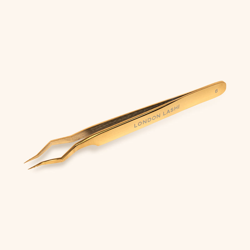 picture of gold isolation tweezers in full size with eyelashes engraving 