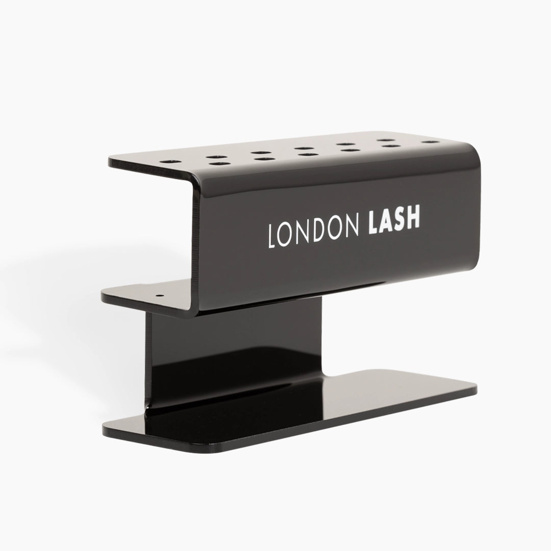 Black lash extension holder with 'London Lash' branding on a white background