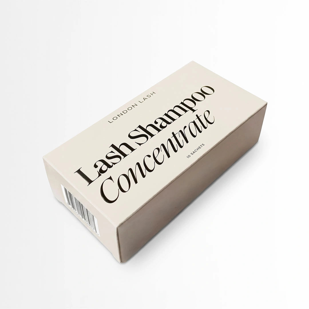 A cream-colored rectangular box for London Lash Lash Shampoo Concentrate, featuring black text on a clean white background.