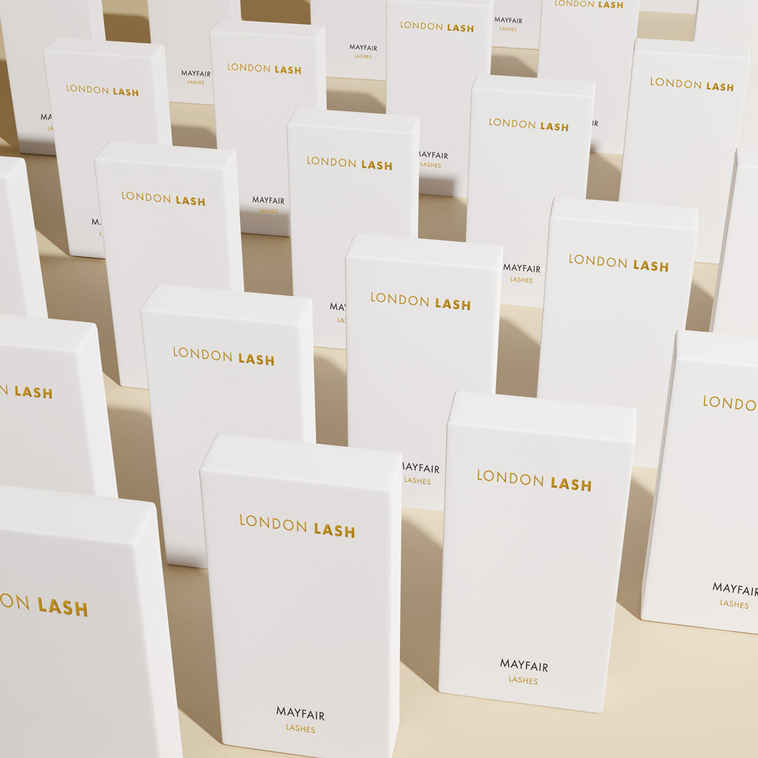 many white london lash  mayfair eyelash extension trays placed in a row
