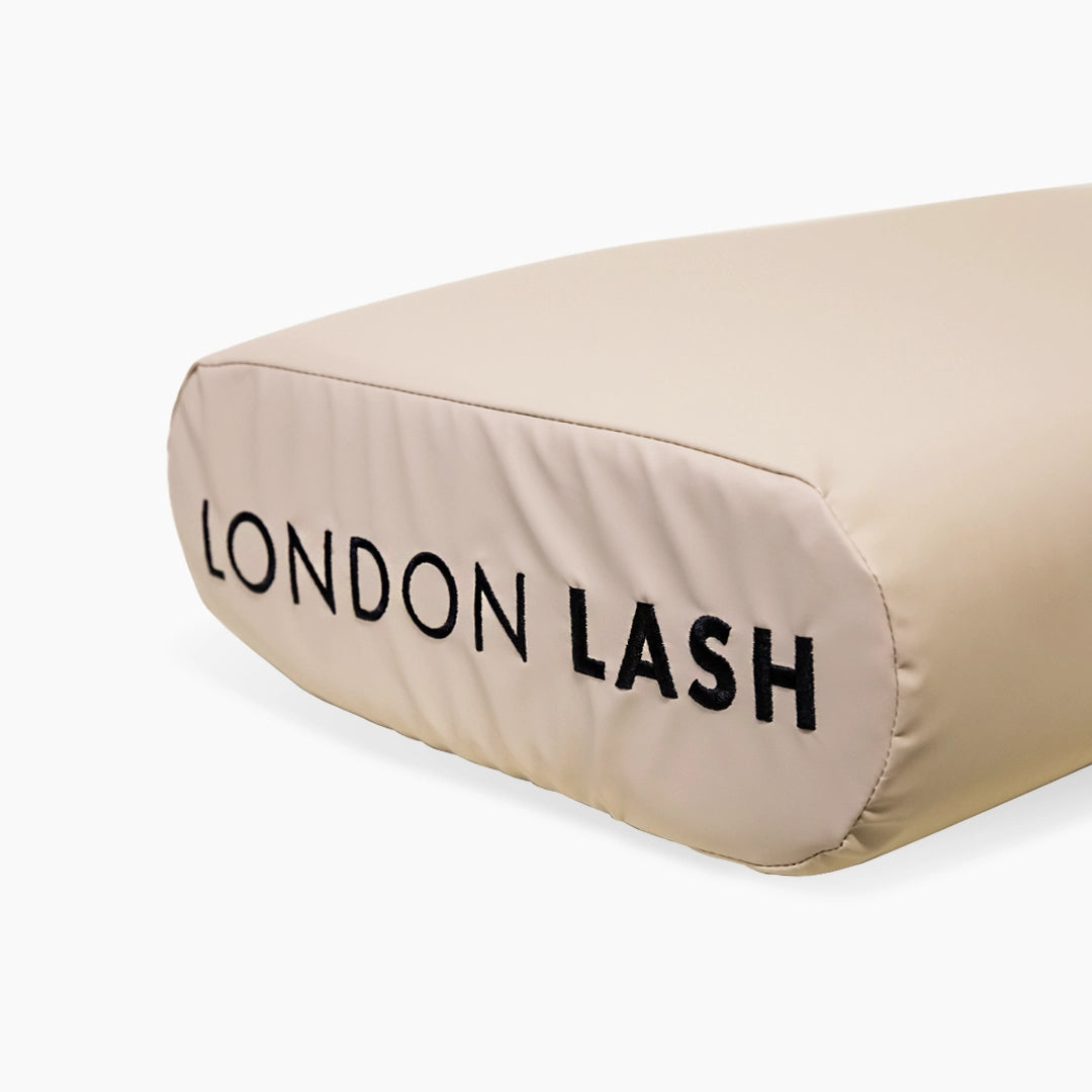 Beige Memory Foam Lash Pillow pillow with 'London Lash' branding on a white background