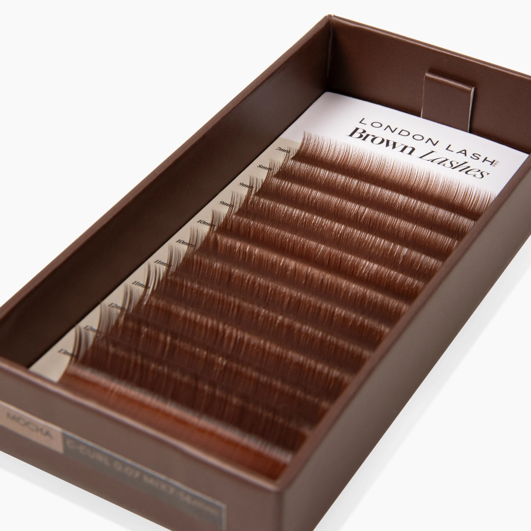 warm brown eyelash extensions inside brown lash tray