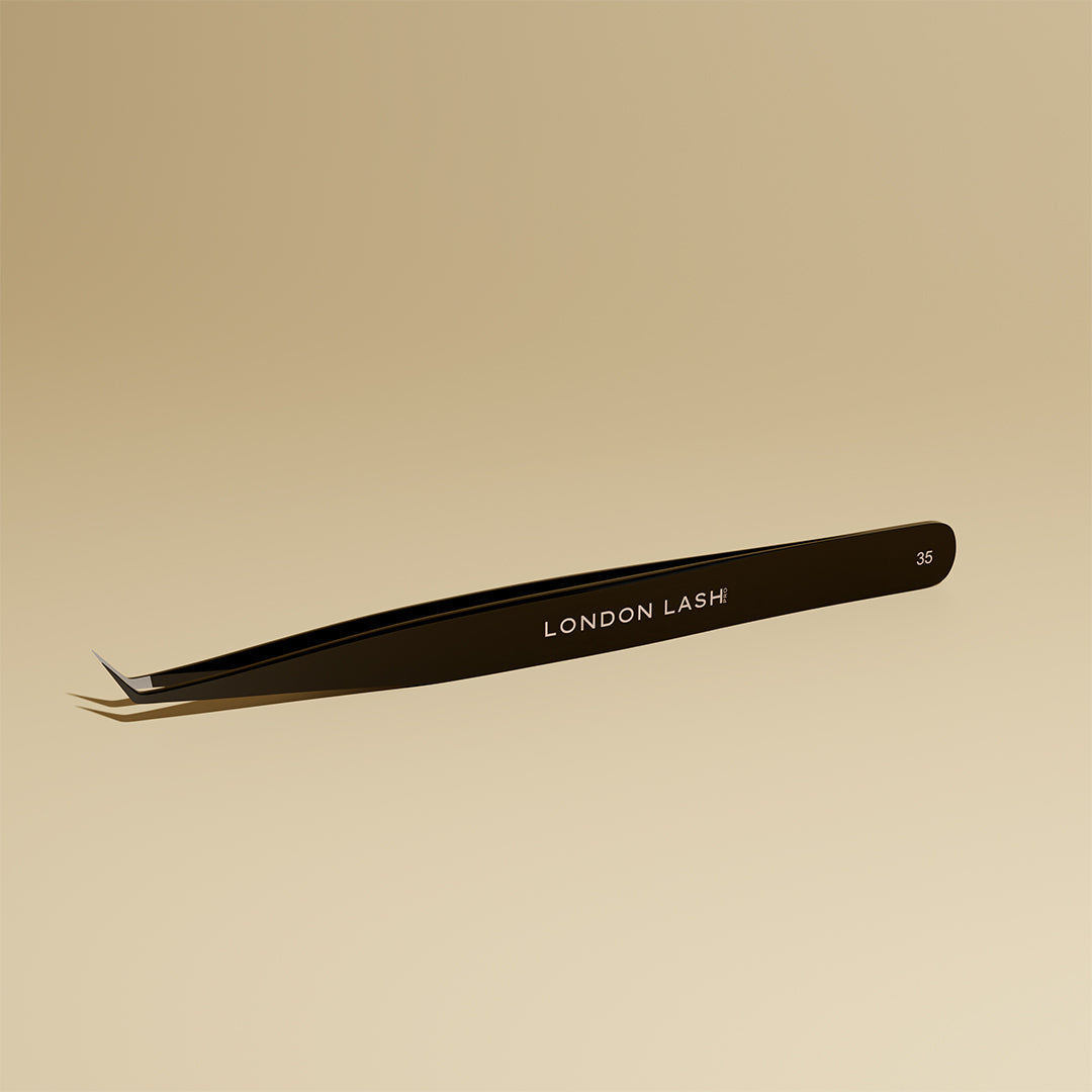 Close-up of fiber tip tweezers point and gripping surface for volume lashes