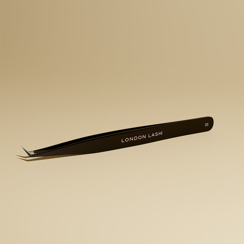Close-up of fiber tip tweezers point and gripping surface for volume lashes