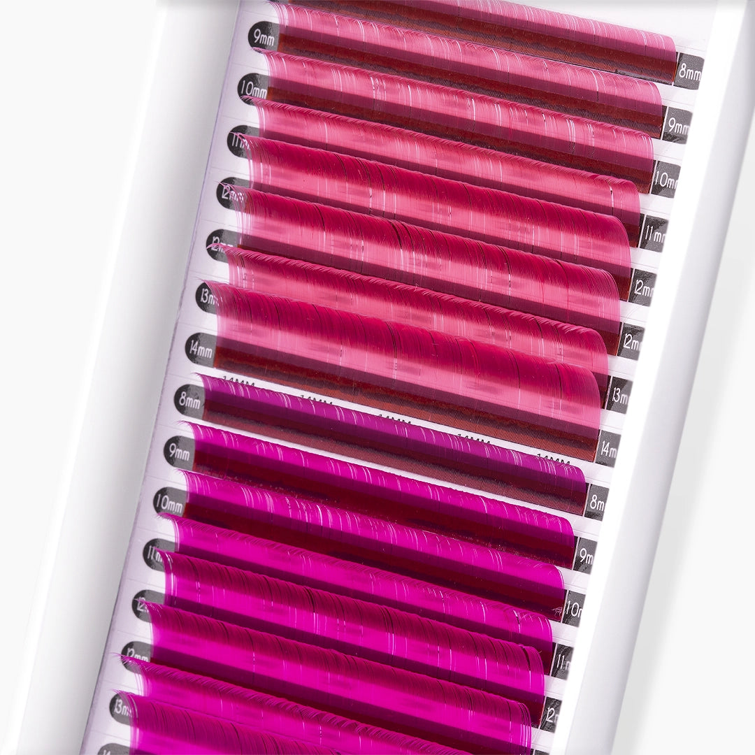 Close up picture of pink and hot pink faux mink coloured lash extension strips and curls on white background