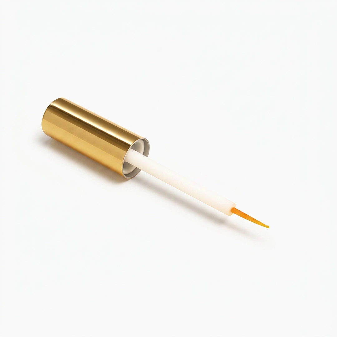 Styling gel for lash spikes bottle with gold cap on a white background