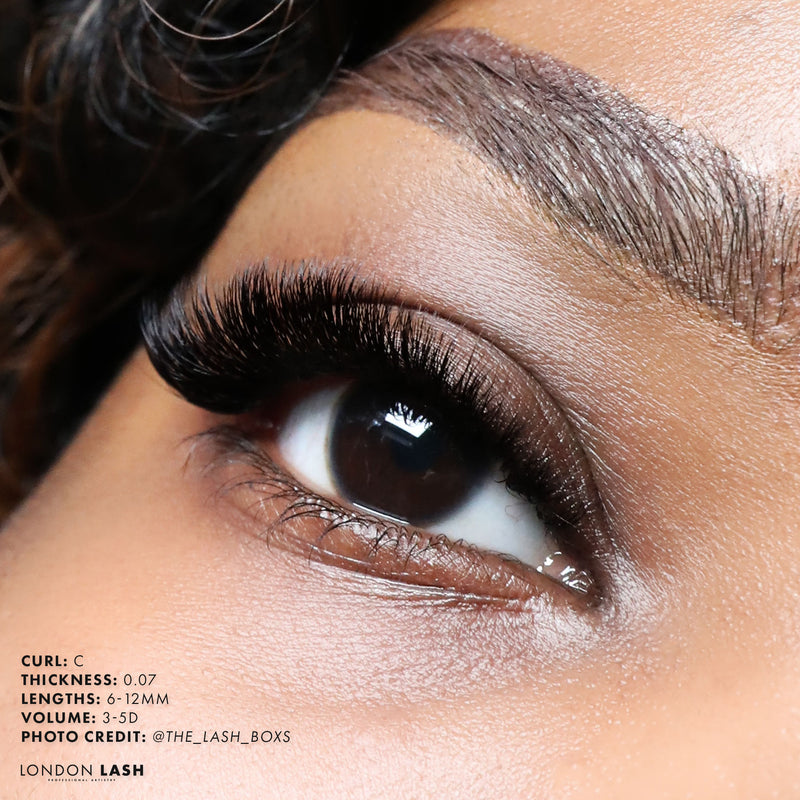 a set of volume lashes on a model using C curl lashes